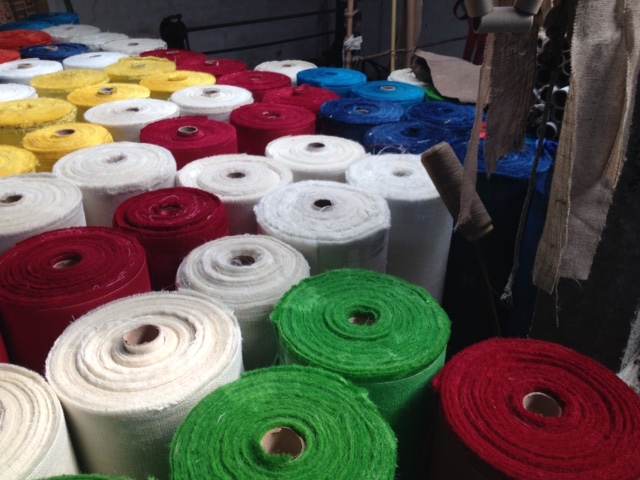 Vibrant colored fabric samples showing various dye options for custom bag designs