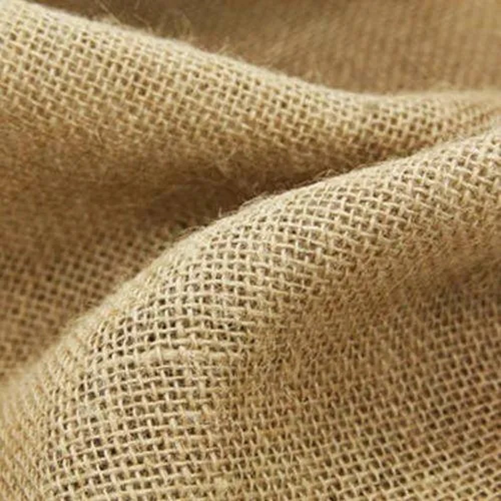 Woven jute fabric roll showing natural texture and quality at Jucofabs